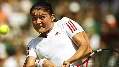 Dinara Safina makes a return during her three-set win over Sabine Lisicki yesterday in the quarter-finals at Wimbledon.