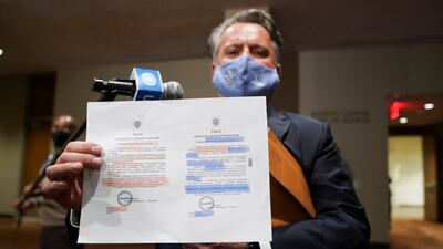 Ukrainian envoy Sergiy Kyslytsya shows documents to journalists. Reuters