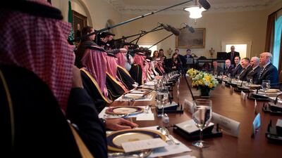 US President Donald Trump (center R) holds a lunch meeting with Saudi Arabia's Crown Prince Mohammed bin Salman (center L), and members of his delegation, in the Cabinet Room of the White House in Washington, DC, March 20, 2018. / AFP PHOTO / SAUL LOEB