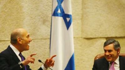 Gordon Brown smiles as Ehud Olmert makes an address to the Israeli Parliament.