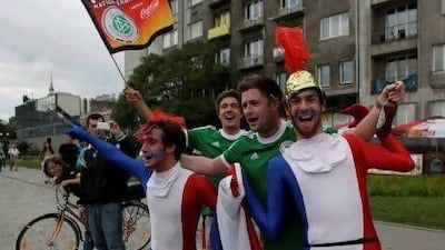 Fans on their way to the National Stadium today. Kacper Pempel / Reuters