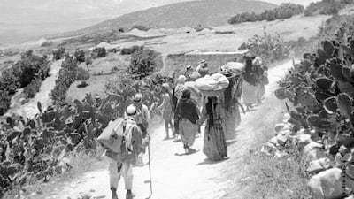 Arab refugees return to their village after its surrender during the 1948 war that followed the foundation of Israel. AFP
