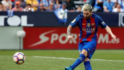Barcelona’s Lionel Messi scores a goal from the penalty spot. Sergio Perez / Reuters