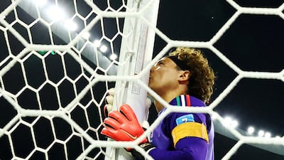 Mexico's Guillermo Ochoa kisses the post as he celebrates after the match against Czech Republic in Mexico City. Reuters