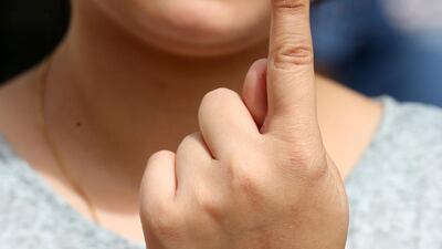 A first time voter shows her inked finger after casting her vote at a polling station during the sixth phase of the Indian parliamentary election in Bhopal, India. EPA