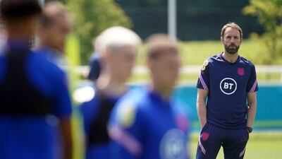 England manager Gareth Southgate watches his players during a training session at St George's Park. PA
