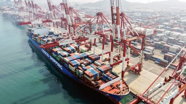 A cargo ship operated by Cosco Shipping is docked at the foreign trade container terminal of Qingdao Port, operated by Shandong Port Group, in China's eastern Shandong province. Chinese shipping giant Cosco said on March 25 that it was resuming new bookings for container shipments to some Gulf countries, after a three-week suspension in response to the Middle East war. AFP