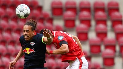 Leipzig's Danish forward Yussuf Poulsen, left, heads the ball. AFP