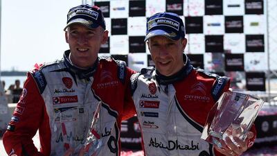 Abu Dhabi Citroen British driver Kris Meeke (R) and Irish co-driver Paul Nagle pose after the podium ceremony in Matosinhos on May 22, 2016. Francisco Leong / AFP