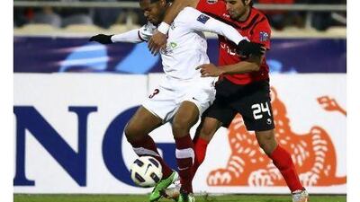 Josef Hickersberger believes his side's point against Persepolis, in red, in the Asian Champions League on Wednesday, was good for his side's morale ahead of their game with Al Wasl today. Amin Mohammad Jamali / Reuters