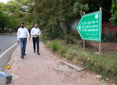 People walk on a road earlier named Aurangzeb Road, after the Mughal emperor, now renamed to Dr. A. P. J Abdul Kalam, India's former president, in New Delhi, Thursday, June 2, 2022. AP