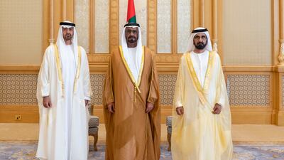 Sheikh Mohammed bin Rashid, Vice President, Prime Minister and Ruler of Dubai, and Sheikh Mohamed bin Zayed, Crown Prince of Abu Dhabi and Deputy Supreme Commander of the Armed Forces, stand for a photograph with Abdullah Al Ketbi, Minister of Federal Supreme Council Affairs.