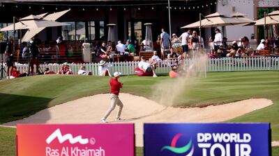 Adrian Meronk of Poland plays his bunker shot on the 18th hole. Getty