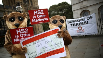 Protesters dressed as otters demonstrate against HS2 near Parliament in London in November 2013. Getty Images