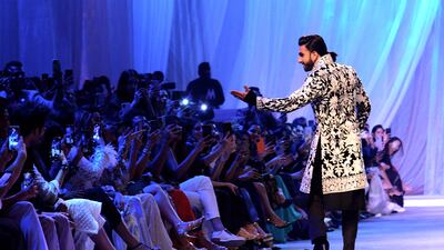 Ranveer Singh gestures to the crowd.