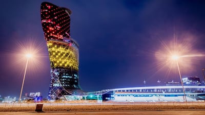 Capital Gate in Abu Dhabi lit up in the colours of the Belgian flag to show support following terrorist attacks in Brussels. Courtesy Jonathan Gibbons Photography
