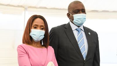 Botswana first lady Neo Masisi, left, holds the diamond while standing next to Botswana President Mokgweetsi Masisi in Gaborone, Botswana, on June 16, 2021. AFP