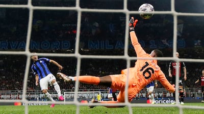 Inter Milan's Henrikh Mkhitaryan scores their second goal past AC Milan's Mike Maignan. Reuters