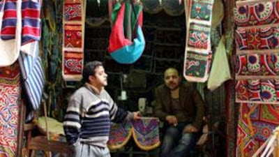Stallholders wait for business in Shari al-Khayamiya, the colourful tent-makers market, where rugs, tapestries, fabric, and of course, tents are on sale.