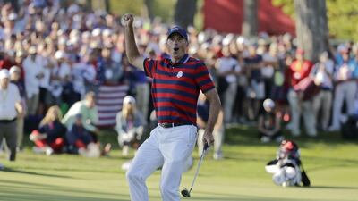 Matt Kuchar of the United States celebrates his birdie on the 13th hole. Charlie Riedel / AP Photo