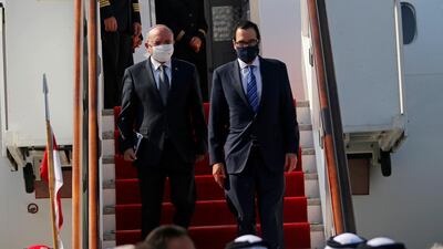Israeli National Security Adviser Meir Ben-Shabbat and US Treasury Secretary Steve Mnuchin disembark the plane upon their arrive in Muharraq, Bahrain. Reuters