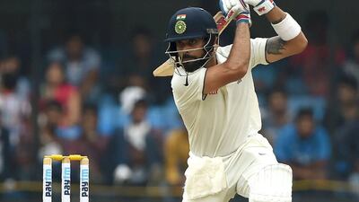 India's Virat Kohli plays a shot against New Zealand on Saturday on the first day of the third Test against New Zealand. Punit Paranjpe / AFP / October 8, 2016