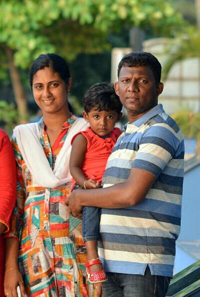 Deepa Kumar was among 17 passengers who died in the accident. He is pictured with his wife Athira and their daughter Amulya, who both survived the crash. Courtesy: Kumar family