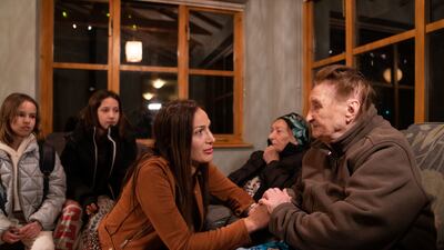 Ludmila Starkova, 90, who fled Kharkiv in Ukraine with her family after the Russian invasion, talks to local resident Rend Platings in her new home in Caldecote near Cambridge on Tuesday. The family of 10 were helped by Ms Platings to find a home in the UK. PA