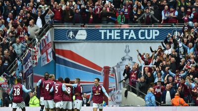 Aston Villa celebrate after Fabian Delph's eventually winning goal in their FA Cup semi-final victory over Liverpool on Sunday at Wembley. Ben Stansall / AFP