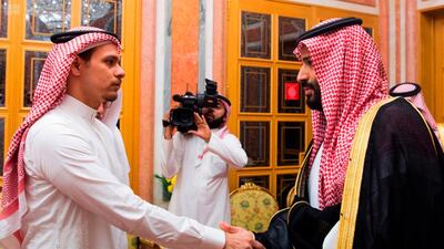 Saudi Crown Prince Mohammed bin Salman, right, shakes hands with Salah Khashoggi in Riyadh on October 23, 2018. Saudi Press Agency