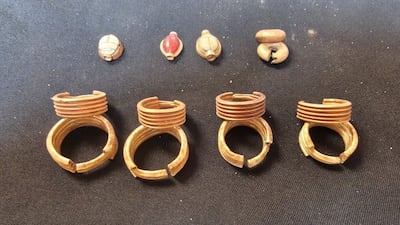 Four metal earrings, thought to be made of gold, are among the objects found at the site in Cairo. Photo: Egyptian Ministry of Tourism and Antiquities