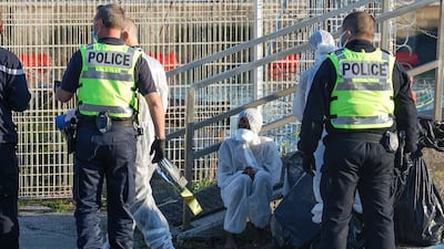 French police in Calais help migrants rescued after their boat got into trouble while trying to reach England. AFP