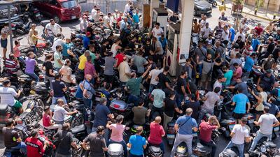 Motorcycle riders wait for fuel at a petrol station in Beirut. AP