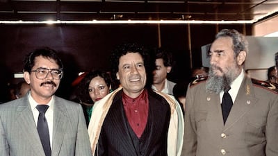 Fidel Castro with Libyan leader Muammar Qaddafi, centre, and Nicaraguan president Daniel Ortega during the non-aligned countries summit in Harare, Zimbabwe, on September 4, 1986. Alexander Joe / AFP