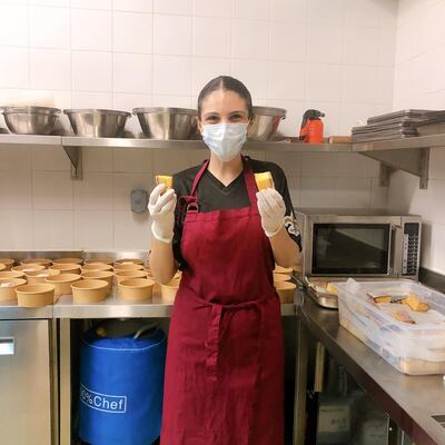 Kenza Jarjour, one of the owners of Inked, prepares meals for donation to the Dubai Food Bank.