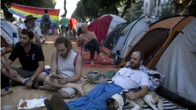 Discontent spreads to Israel, as Tel Aviv residents sit among dozens of tents that have been pitched in protest against the rising prices of property in the country. Menahem Kahana / AFP Photo