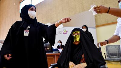 Qatari women arrive to cast their votes. Reuters