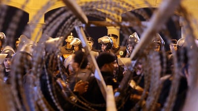 Twenty-two people were killed as thousands of fans tried to force their way into a Cairo football stadium to watch a game, triggering panic as police fired tear gas and birdshot at the crowds. Al Youm Al Saabi / Reuters