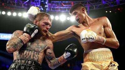 Sebastian Fundora (R) punches Daniel Lewis during their junior middleweight bout at MGM Grand Garden Arena in Las Vegas. AFP