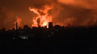 Balls of fire rise above Gaza city during Israeli strikes on Friday. AFP
