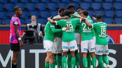 Saint-Etienne's Romain Hamouma is mobbed by teammates after scoring his team's second goal. AP