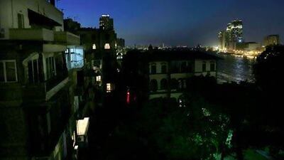 The Zamalek neighbourhood of Cairo during a power cut. Any future electricity deficits could be met by supply from Saudi as the two countries plan to connect grids. Hassan Ammar / AP Photo