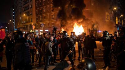 Demonstrators argue with police officers towards the end of a Catalan pro-independence protest outside the Camp Nou stadium. AP