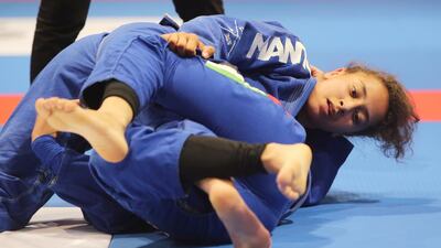 Maha Al Hinaai of the UAE shown in her match with Maitha Abdulla Abdulla (on top) of the UAE in the Abu Dhabi World Youth Jiu-Jitsu Championship 2016. Ravindranath / The National