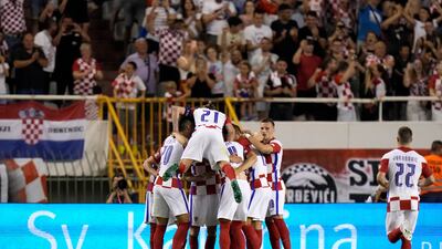 Croatia's Andrej Kramaric celebrates with teammates after scoring his side's equaliser from the penalty spot. AP Photo