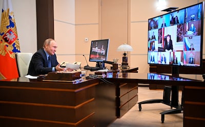 Russian President Vladimir Putin takes part in a videoconference at his residence outside Moscow. AP