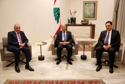 Lebanese President Michel Aoun, centre, meets Lebanese Prime Minister-designate Hassan Diab, right, and Parliamentary Speaker Nabih Berri. AP