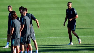 Cristiano Ronaldo is all smiles during training. AFP