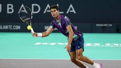 Carlos Alcaraz hits a volley to Andrey Rublev. Reuters