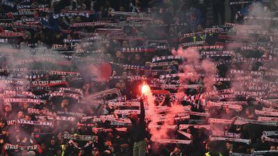 PSG supporters cheer for their team during the French Cup final against Rennes at Stade de France in Saint-Denis, outside Paris on Saturday night. Anne-Christine Poujoulat / AFP
